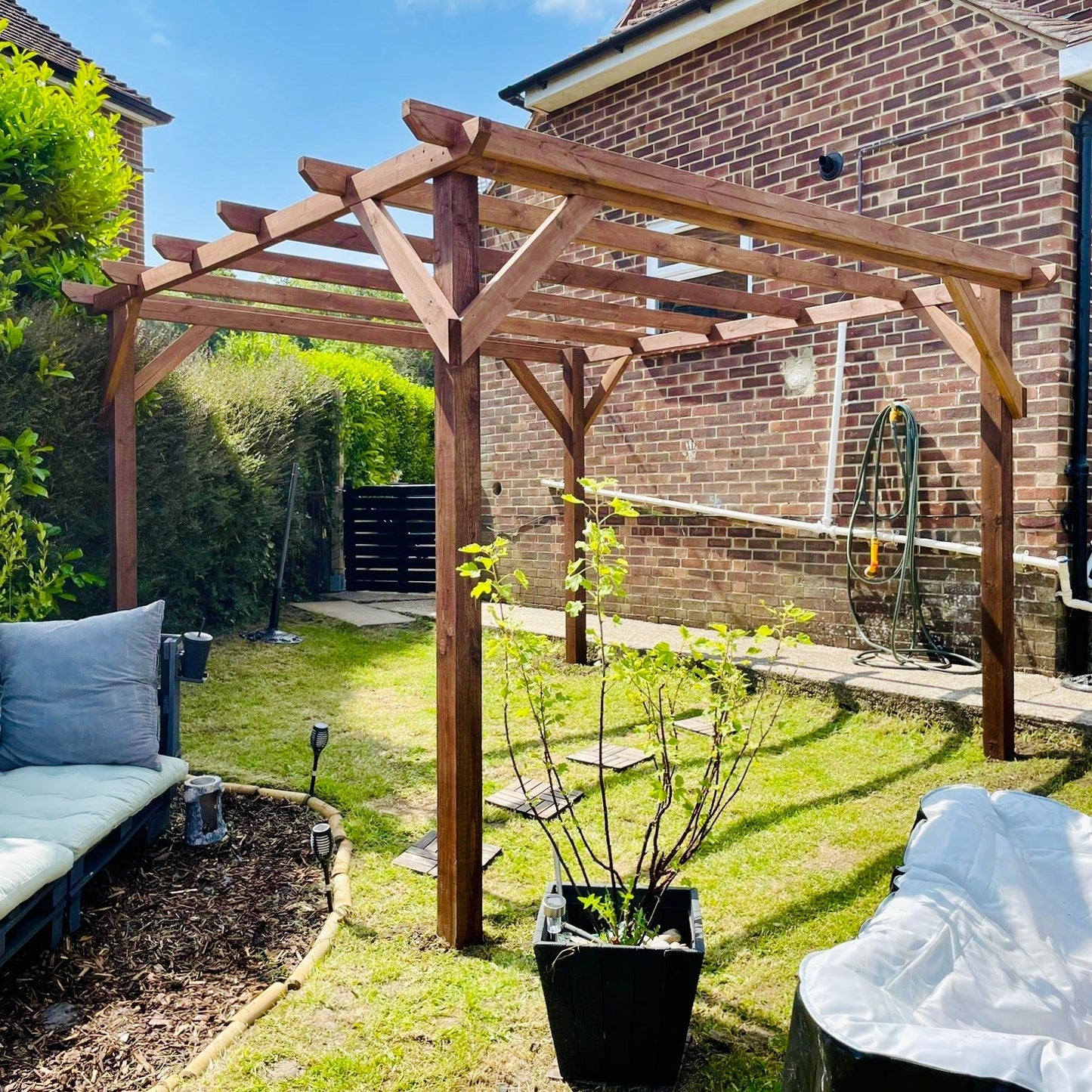 Explore sustainable outdoor living with the Wooden Eco Pergola: Crafted from natural wood, this elegant structure adds shade, style, and eco-conscious appeal to your garden or patio.