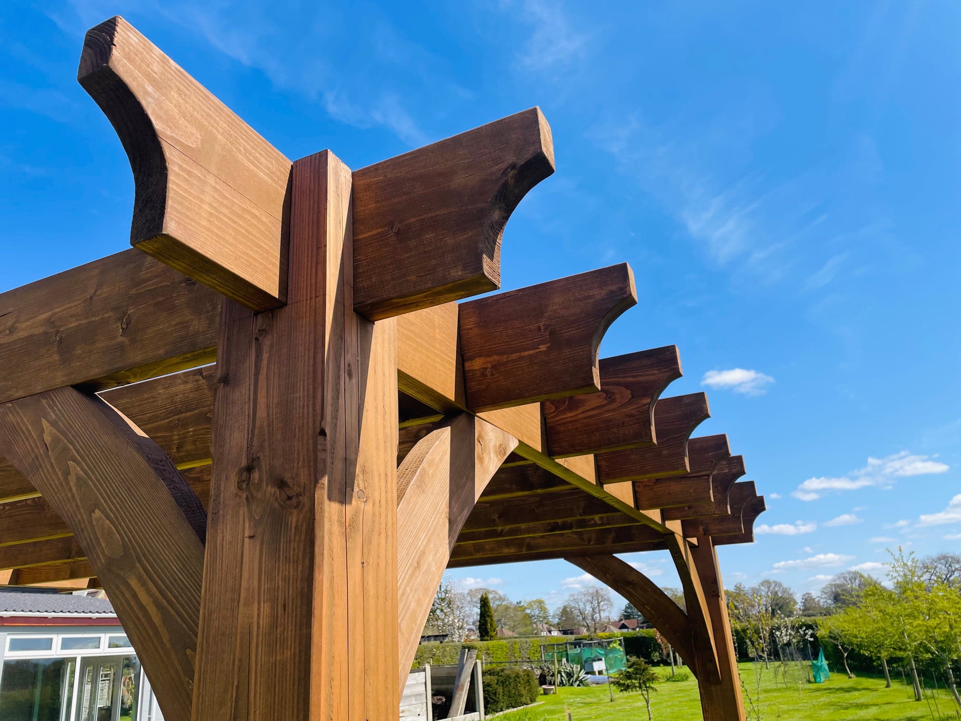 Enhance your outdoor oasis with the Wooden Luxury Pergola Patio: A sophisticated addition for creating a stylish and comfortable space to relax and entertain in your garden or patio.